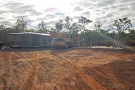 Lifting the elevated house modules into place