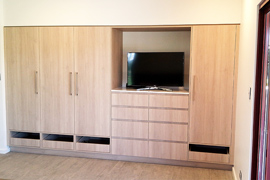 Bedroom built in cabinets with TV