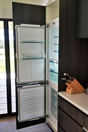 Fridge integrated into kitchen cabinet